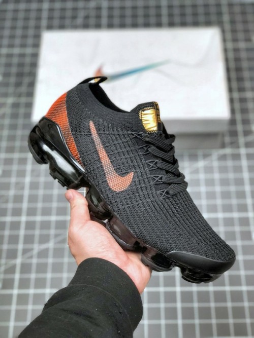 gray and orange vapormax flyknit