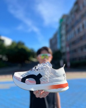 On Cloudboom Strike White Orange Women s