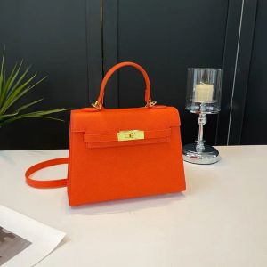 Hermes Kelly Top Handle Bag (Orange) (no return)